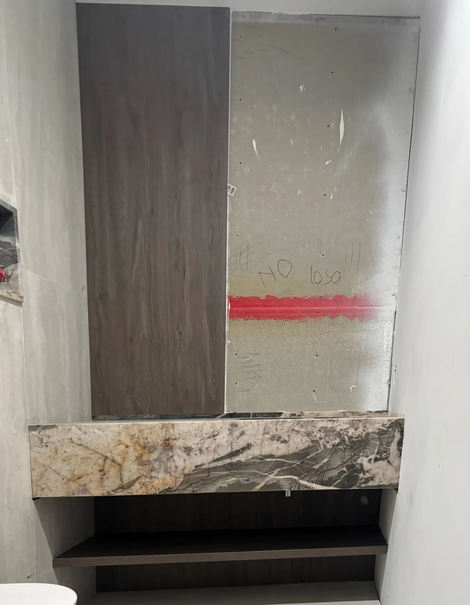 Powder room, lit stone vanity, in progress