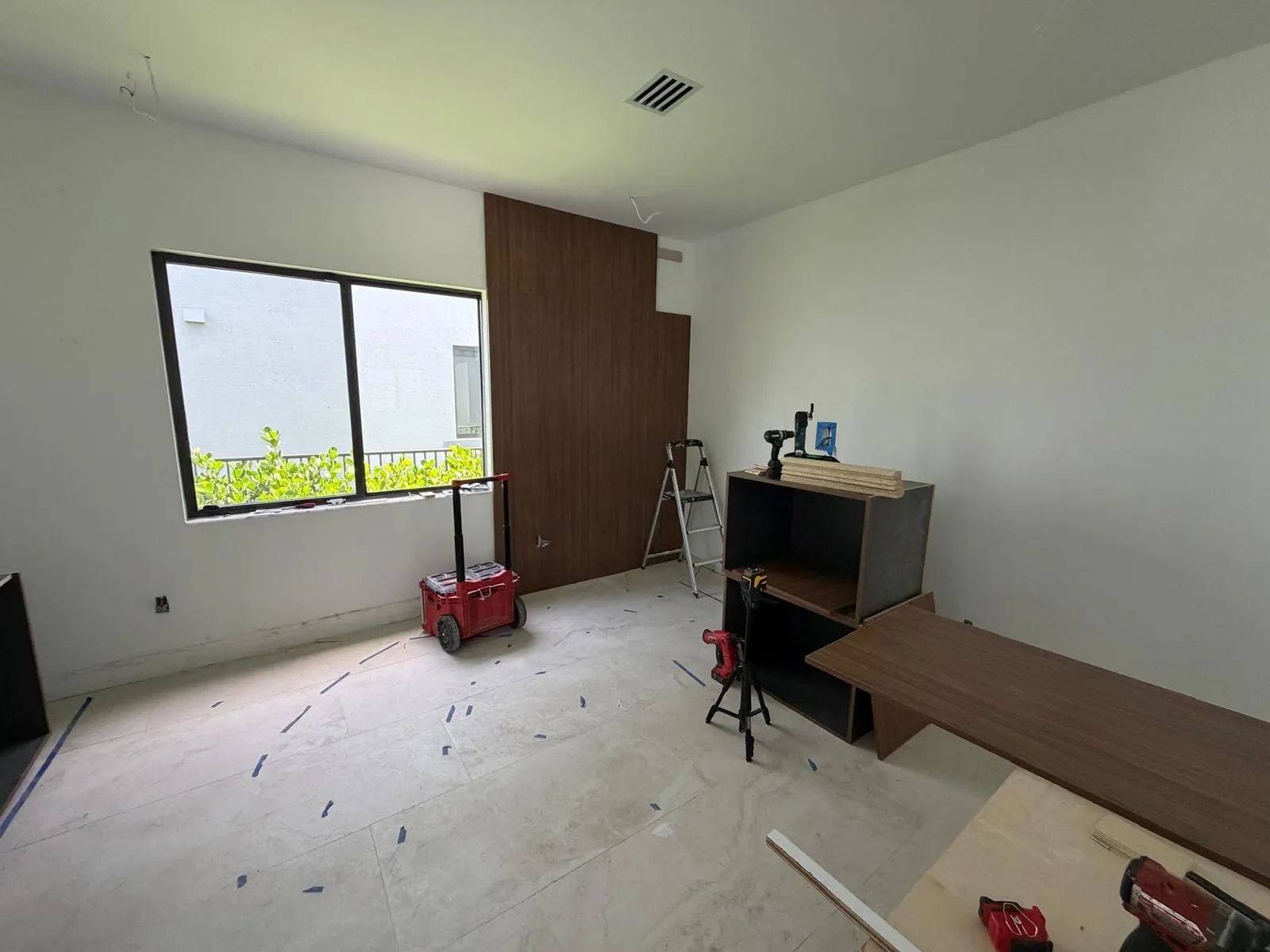 Walnut-tone media wall, in progress
