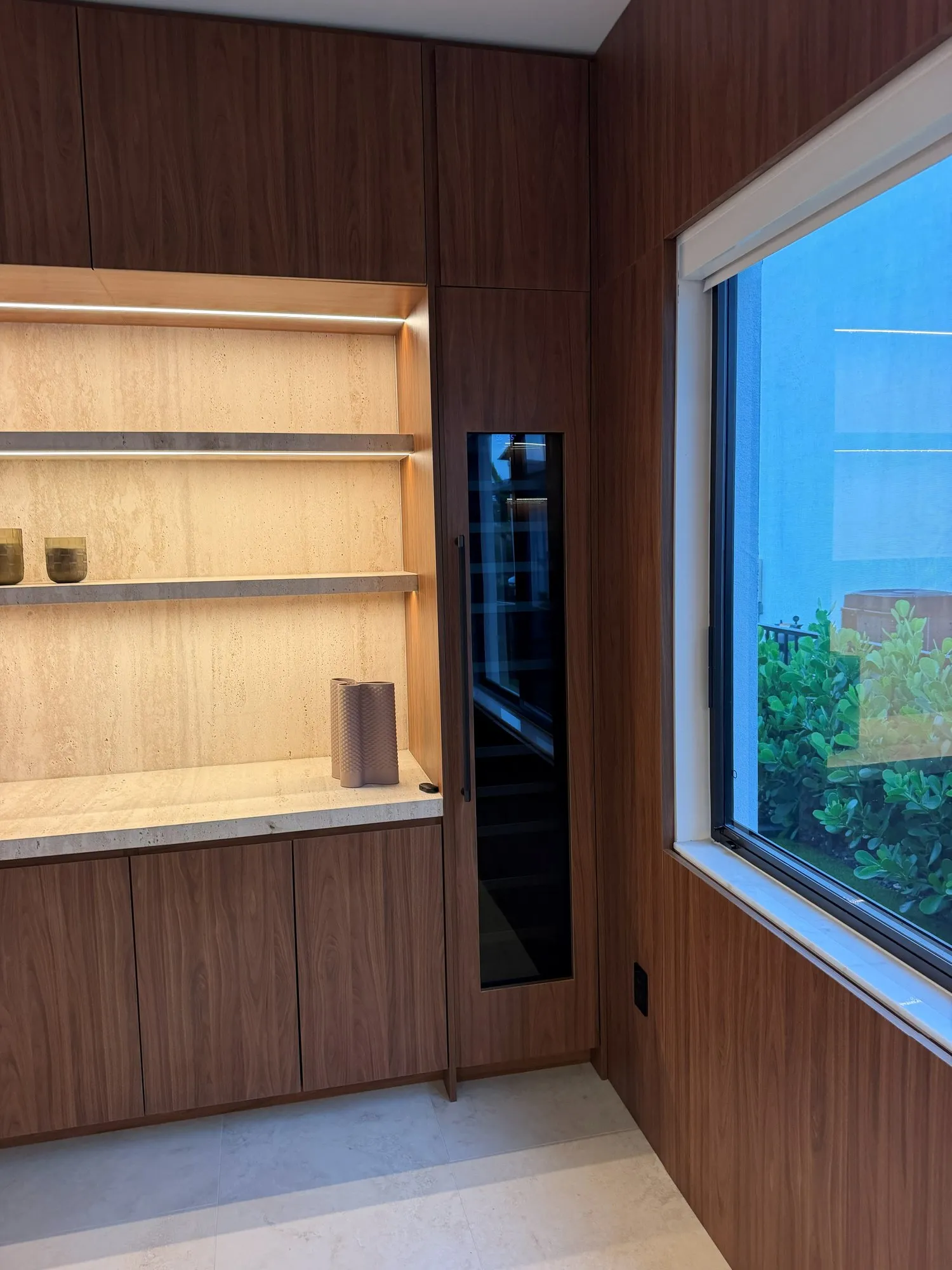 Walnut-tone media wall, finished